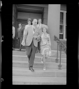 Outside Middlesex County Courthouse are ex-Mayor Edward F. Gill (foreground), Mrs. Florence Volpe, accompanied by her husband, and Charles DiPanfilo