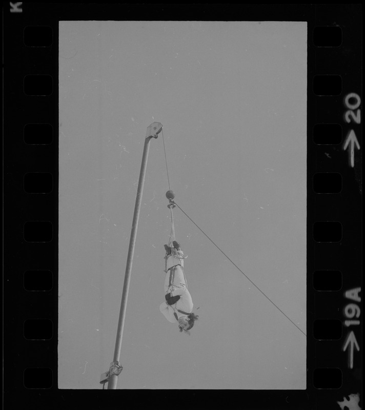 Hanging for the fun of it - Norman Bigelow shows off his Houdini talents above Boston College