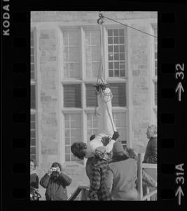 Hanging for the fun of it - Norman Bigelow shows off his Houdini talents above Boston College