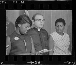 Mrs. Roberta O'Neil, left, and Father George Spagnolia, center, welfare rights activists