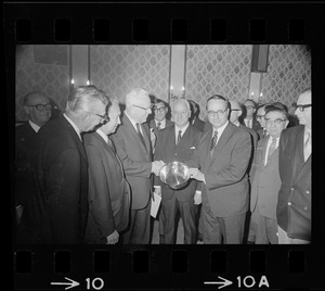 Boston attorney Thomas E. Cargill, right, presents silver bowl to Chief Justice Earl Warren on behalf of the Massachusetts delegation