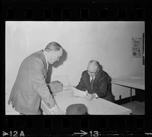 Teddy Green, reformed bank robber, seen with Election Comr. Perlie Dyar Chase