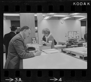 Teddy Green, reformed bank robber, filling out questionnaire