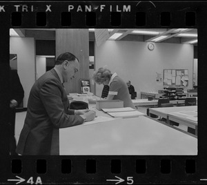 Teddy Green, reformed bank robber, filling out questionnaire
