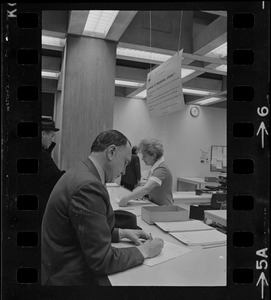 Teddy Green, reformed bank robber, filling out questionnaire