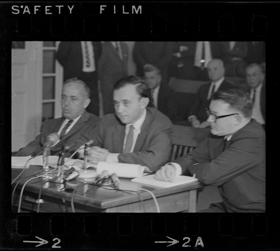 Frederick Wiseman, 'Titicut' producer, flanked by his attorneys is James St. Clair (left), and Blair L. Perry, at hearing before State Commission on Mental Health