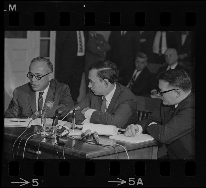 Frederick Wiseman, 'Titicut' producer, flanked by his attorneys is James St. Clair (left), and Blair L. Perry, at hearing before State Commission on Mental Health