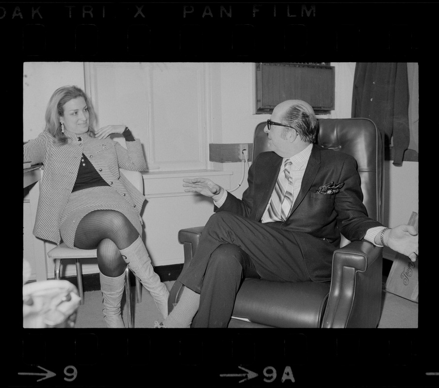 Phil Silvers speaking with a woman while he is in Boston to perform in the comedy "How the Other Half Loves" at the Wilbur Theater