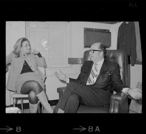 Phil Silvers speaking with a woman while he is in Boston to perform in the comedy "How the Other Half Loves" at the Wilbur Theater