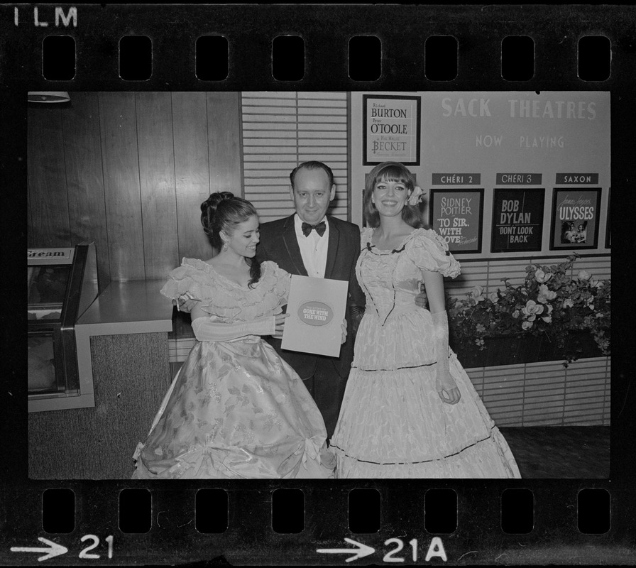 Ben Sack, theatre owner, seen with group at showing of "Gone with the Wind" film at Gary Theatre in the Back Bay