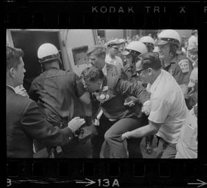 Josef Mlot-Mroz being apprehended during protests after the sentencing of Dr. Spock and others for draft conspiracy charges