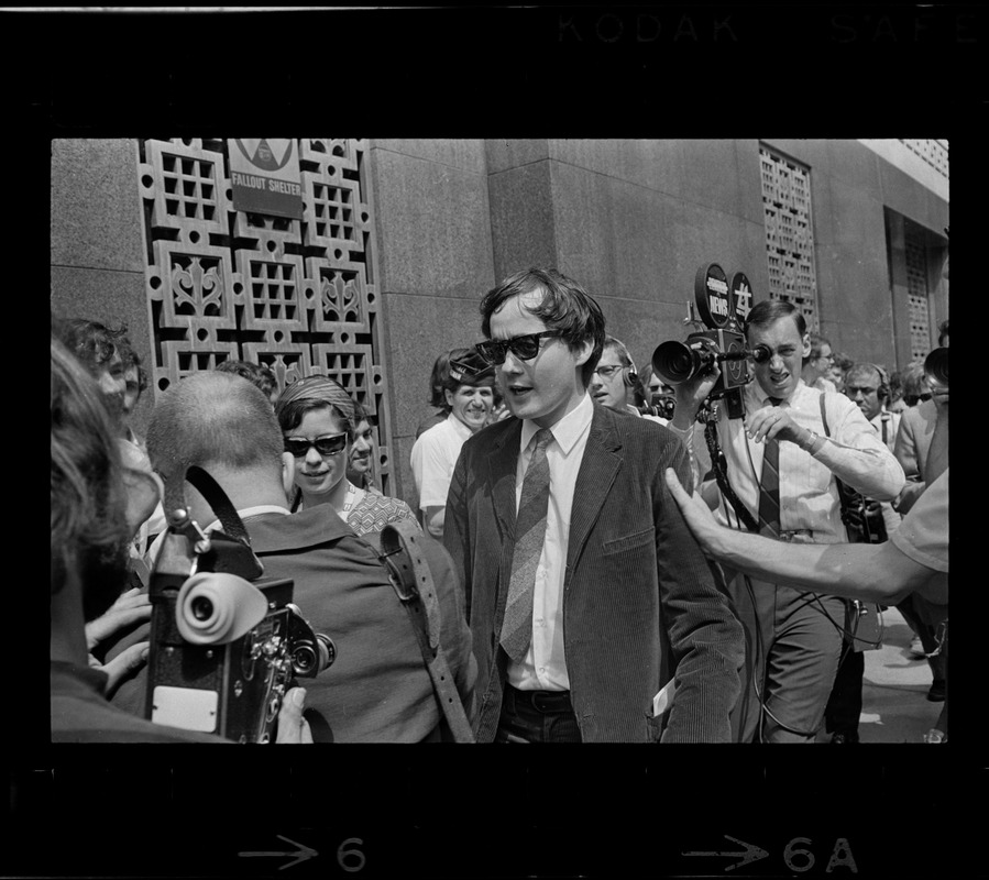 Michael Ferber, Harvard graduate student, surrounded by crowds outside the Federal Courthouse
