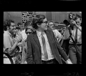 Michael Ferber, Harvard graduate student, surrounded by crowds outside the Federal Courthouse where he appeared for sentencing on draft conspiracy charges