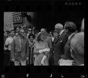 Dr. Benjamin Spock and Jane Spock, center, and other defendants outside Federal Courthouse for sentencing on draft conspiracy charges