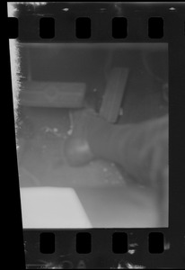 Foot seen between car accelerator and brake