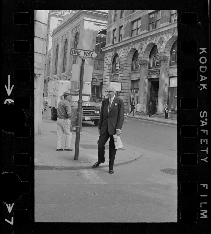 Dr. Benjamin Spock on street corner outside Federal Courthouse where he is appearing for pre-trial hearing