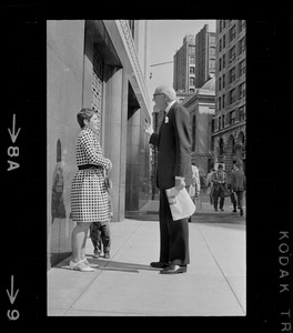 Mrs. Barbara McCoy introduces son Patrick to Dr. Benjamin Spock on street outside Federal Courthouse where he is appearing for pre-trial hearing