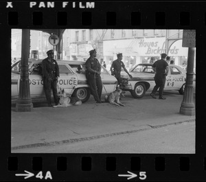 Police surveillance at a transportation station after disturbance during Puerto Rican Day celebration in Blackstone Park