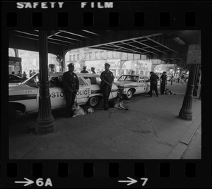 Police surveillance at a transportation station after disturbance during Puerto Rican Day celebration in Blackstone Park