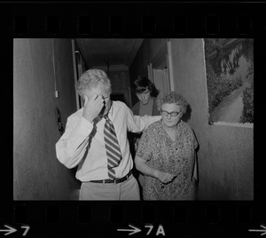 Mayor White and an older woman walking through a hallway