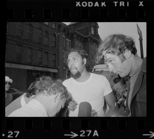 A man being interviewed after disturbances following Puerto Rican Day in the South End