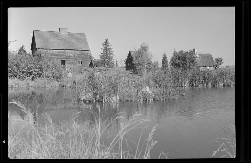 Pioneer Village, exterior of houses, pond Digital Commonwealth