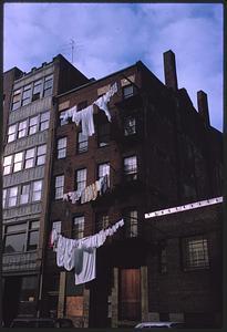 Laundry hanging on clotheslines outside building, Boston