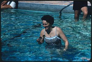 Woman in swimming pool, Eden Roc Hotel, Miami Beach, Florida