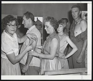 Guarding Health of Flood Victims-Dr. Helen Howard was busy in flooded Southbridge inoculating residents against typhoid. Lineup was common in many stricken New England communities as medicines were flown in.