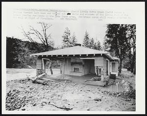 Normally placid Little Butte Creek (left) became a swollen torrent last week and knocked out walls and windows of the living room of the Leland Charley residence in the Lake Creek area. Christmas cards still remain attached to the wall at right of fireplace.