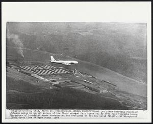 Presidential Aerial Inspection--A jet plane carrying President Johnson makes an aerial survey of the flood ravaged Ohio River Valley over West Virginia today. Governors of inundated areas accompanied the President on the low level flight.