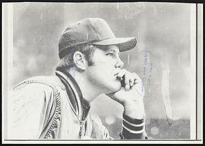 A Tiger catcher's thoughts are long long thoughts - and gloomy ones. Bill Freehan, hitless so far in the World Series, watches it rain.