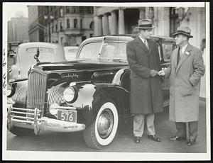 New Packard for Mayor-Mayor Maurice J. Tobin is seen receiving the keys for his new 1941 Packard Super Eight Custom Limousine from Vincent P. Morton,, general sales manager of the Packard Motor Car Company, Inc. The ceremony took place during Boston automobile Show week on Mayor’s Day.