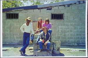 Eddie, Cheryl, Carol and Mary - boarders - sitting on mounting block