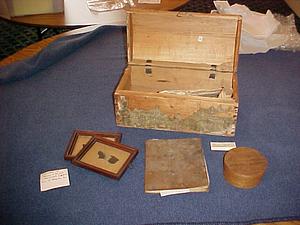 Wooden box with various items