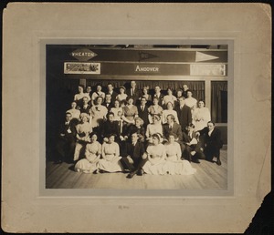 Group portrait below college pennants