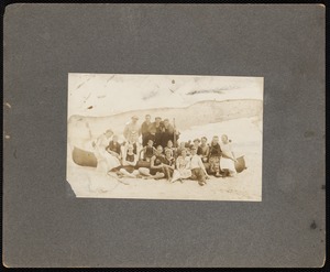 Portrait of group sitting on a canoe