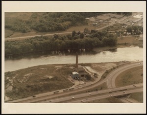 Aerial view of a smokestack and river