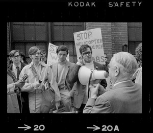 Pickets at MIT -- Dr. Charles Draper, administration head of MIT's Instrumentation Laboratories, speaks to picketing students outside a lab at 45 Osborn st., Cambridge. Students tried to gain entrance but were refused