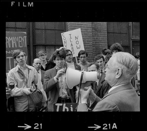 Pickets at MIT -- Dr. Charles Draper, administration head of MIT's Instrumentation Laboratories, speaks to picketing students outside a lab at 45 Osborn st., Cambridge. Students tried to gain entrance but were refused
