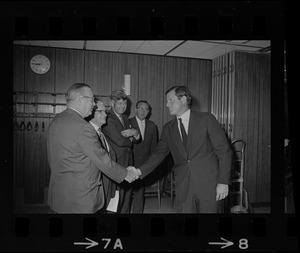Ted Kennedy shaking hands at meeting with Massachusetts mayors