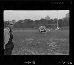 Mayor Kevin White standing near helicopter