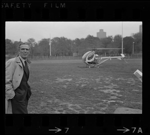 Mayor Kevin White standing near helicopter