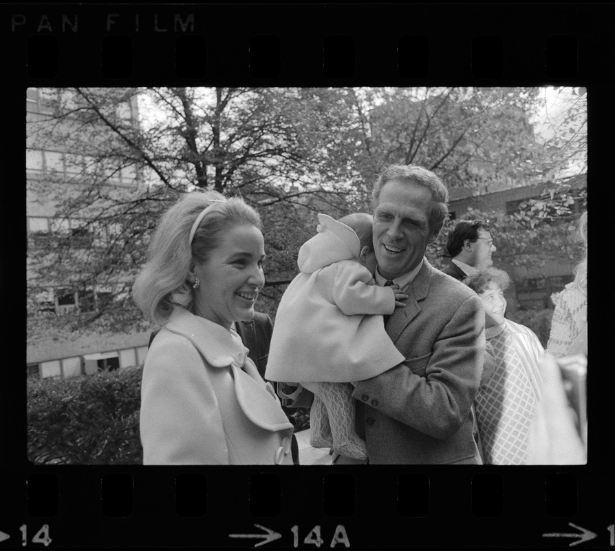 Kathryn White and Boston Mayor Kevin White holding their daughter Patricia after leaving the hospital