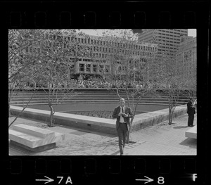 Photographer next to fountain garden at City Hall Plaza before dedication ceremony