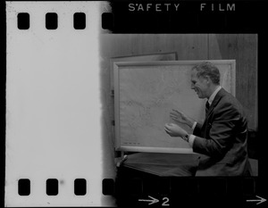 Boston Mayor Kevin White examines hurricane chart with two unidentified men