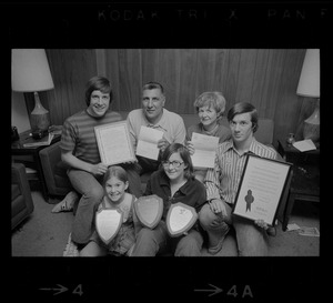 The Abruzzese family holding the many expressions of appreciation presented by President Nixon, J. Edgar Hoover, police and civic groups. From left: Thomas, 15, Rocco Abruzzese and wife Rosemary, David, 18, Mary Ellen, 7, and Susan 13