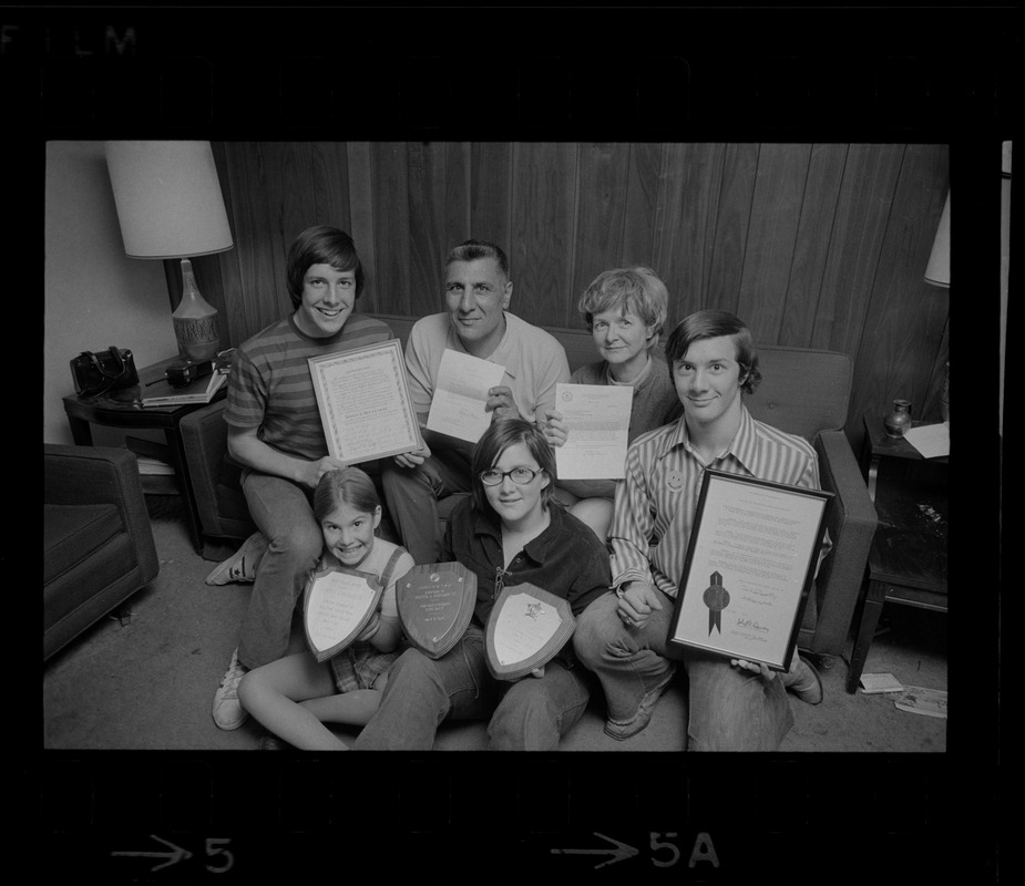 The Abruzzese family holding the many expressions of appreciation presented by President Nixon, J. Edgar Hoover, police and civic groups. From left: Thomas, 15, Rocco Abruzzese and wife Rosemary, David, 18, Mary Ellen, 7, and Susan 13