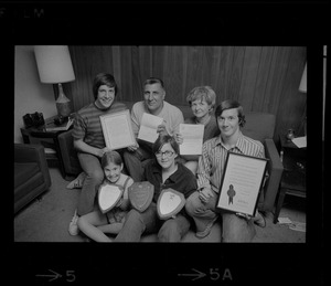 The Abruzzese family holding the many expressions of appreciation presented by President Nixon, J. Edgar Hoover, police and civic groups. From left: Thomas, 15, Rocco Abruzzese and wife Rosemary, David, 18, Mary Ellen, 7, and Susan 13