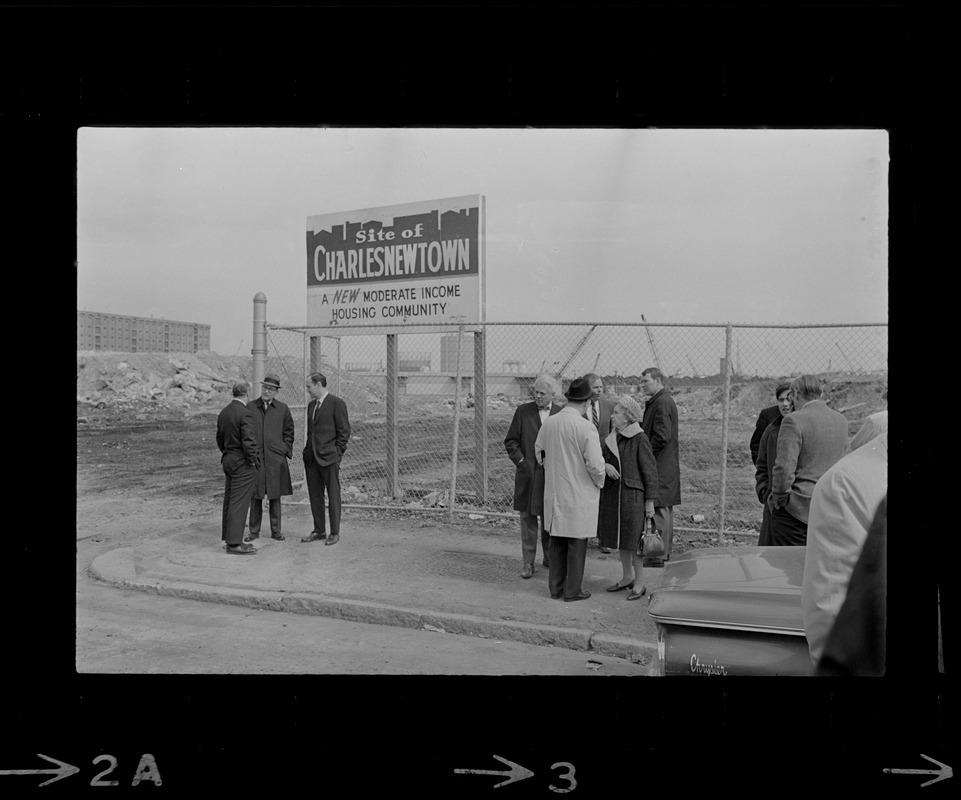 People outside site of new Charlestown housing development before ground breaking ceremony